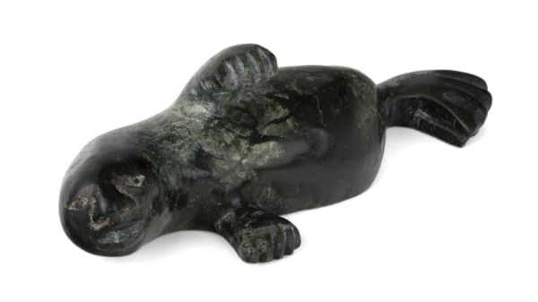 Lot 28 CEE POOTOOGOOK (1967-) KINNGAIT (CAPE DORSET) Swimming Walrus Shaman, 1990s stone, 1.5 x 4.5 x 1.75 in (3.8 x 11.4 x 4.4 cm) ESTIMATE: $150 — $250