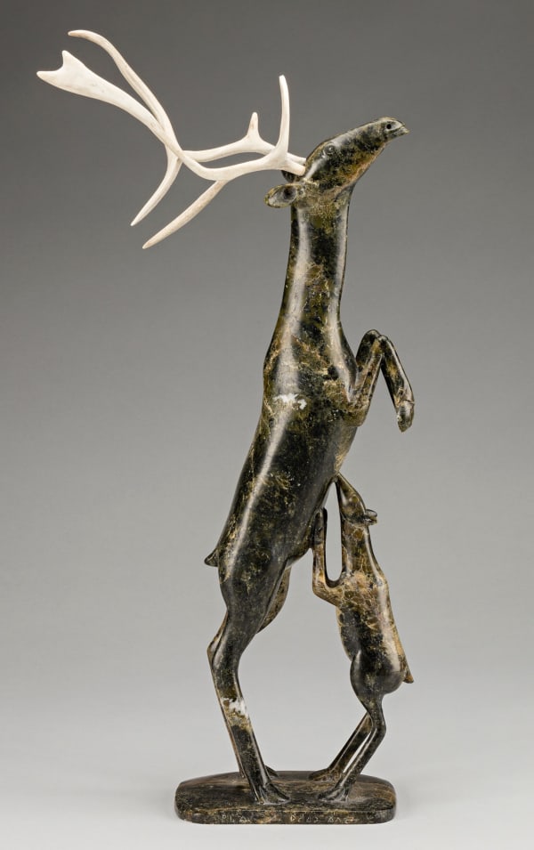 Lot 43 OSUITOK IPEELEE, R.C.A. (1922 or 1923-2005) KINNGAIT (CAPE DORSET Rearing Caribou with Nursing Calf, 1994 stone and antler, 19.25 x 10.5 x 7 in (48.9 x 26.7 x 17.8 cm) ESTIMATE: $25,000 — $35,000 PRICE REALIZED: $33,600.00