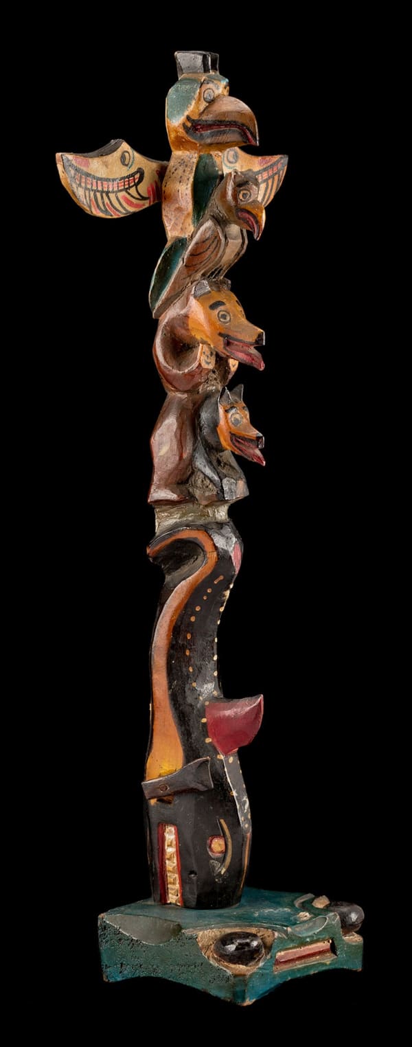 Lot 118 TOM MOSES (1872-1955), COAST SALISH, SQUAMISH Model Totem Pole, c. 1930s carved and painted cedar wood, and metal pins, 15.5 x 5.75 x 3.25 in (39.4 x 14.6 x 8.3 cm) ESTIMATE: $1,800 — $2,800 PRICE REALIZED: $9,600.00