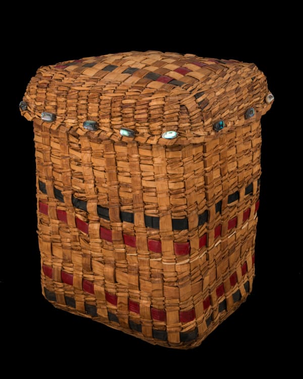 Lot 84 UNIDENTIFIED HAIDA ARTIST Rectangular Lidded Basket with Shell Button Accents, 1990s / 2000s natural and dyed cedar bark, abalone shell, and string, 10.25 x 7.5 x 8.25 in (26 x 19.1 x 21 cm) ESTIMATE: $600 — $900 PRICE REALIZED: $512.40