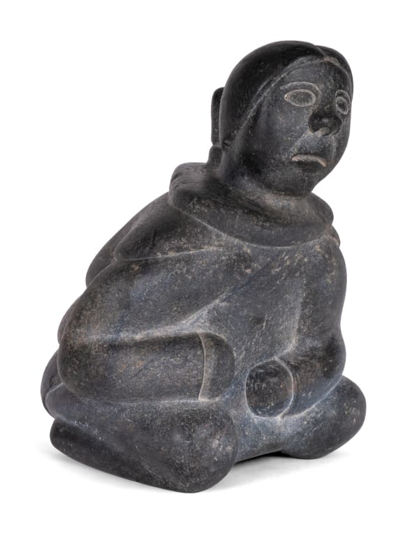 Lot 36 NIVIAQSI (NIVIAKSIAK) (1908-1959) KINNGAIT (CAPE DORSET) Seated Woman, c. 1954-55 stone, 8 x 5.75 x 5.75 in (20.3 x 14.6 x 14.6 cm) ESTIMATE: $4,000 — $6,000