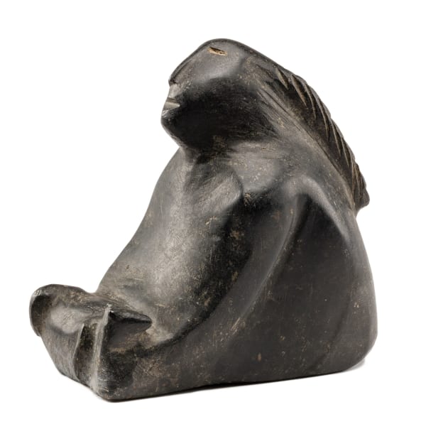 Lot 131 ELIZABETH NUTARAALUK AULATJUT (1914-1998) ARVIAT (ESKIMO POINT) Seated Figure with Dog, c. 1969-70 stone, 5 x 5.25 x 3.25 in (12.7 x 13.3 x 8.3 cm) ESTIMATE: $2,000 — $3,000 PRICE REALIZED: $1,920.00