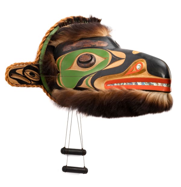 Lot 142 ART THOMPSON (1948-2003) NUU-CHAH-NULTH Raven Transforming into Human, July 1997 red cedar wood, acrylic paint, cedar bark, fur, and abalone, 15.5 x 59 x 6.75 in (39.4 x 149.9 x 17.1 cm) ESTIMATE: $6,000 — $9,000 PRICE REALIZED: $13,200.00