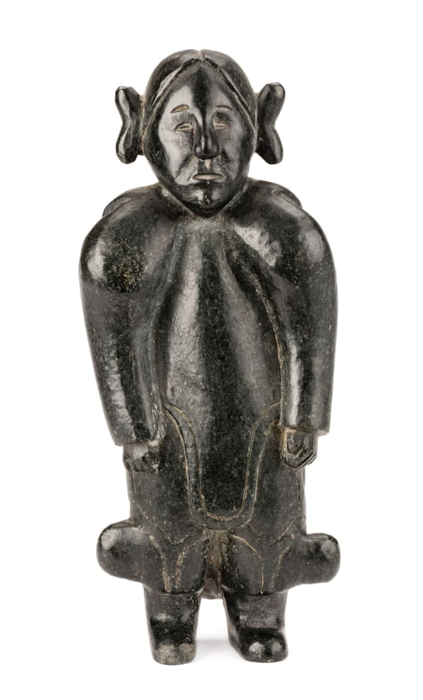 Lot 4 UNIDENTIFIED ARTIST, EASTERN CANADIAN ARCTIC Standing Woman in Traditional Clothing, early 1960s stone, 7 x 3 x 2.25 in (17.8 x 7.6 x 5.7 cm) ESTIMATE: $3,000 — $5,000 PRICE REALIZED: $2,400.00