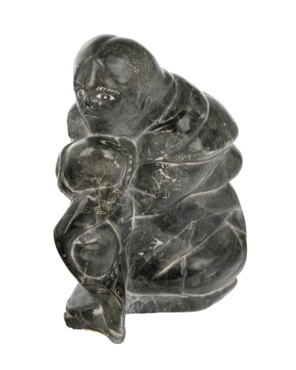 Lot 45 MAKUSI PANGUTU ANAUTA (1939-), PUVIRNITUQ (POVUNGNITUK) / AKULIVIK Crouching Woman with Sealskin, 1973 stone, 6.5 x 3.25 x 5.25 in (16.5 x 8.3 x 13.3 cm) ESTIMATE: $150 — $250 PRICE REALIZED: $244.00