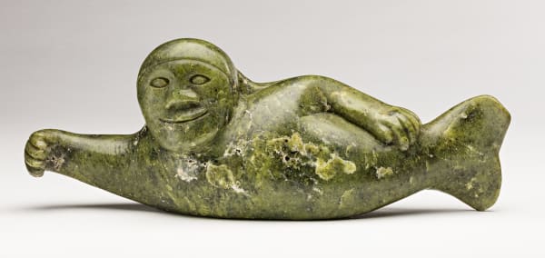 Lot 83 AQJANGAJUK SHAA, R.C.A. (1937-2019) KINNGAIT (CAPE DORSET) Smiling Sedna with Plaited Hair, mid-1960s stone, 4.75 x 12 x 3.75 in (12.1 x 30.5 x 9.5 cm) ESTIMATE: $2,000 — $3,000 Price Realized: $1,920