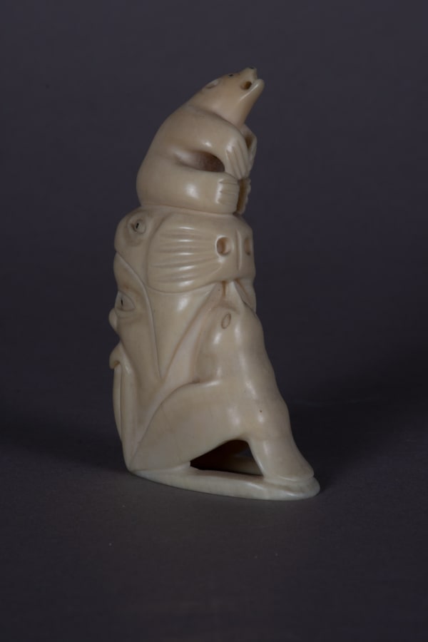 Lot 23 HENRY NAPARTUK (1932-1985) KUUJJUARAPIK (GREAT WHALE RIVER) Totemtic Composition with Arctic Animals, mid-late 1960s tooth and black inlay, 3.75 x 1 x 1.5 in (9.5 x 2.5 x 3.8 cm) ESTIMATE: $400— $600