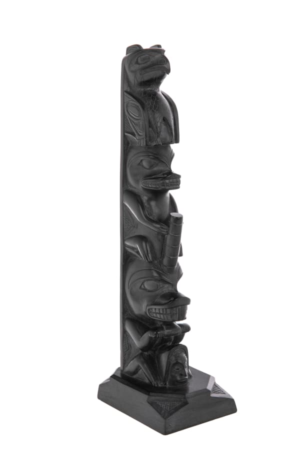 Lot 14 RUFUS MOODY, C.M. (1923-1998) SKIDEGATE, B.C. Model Totem Pole, mid 1970s argillite, 13.25 x 3.25 x 4.25 in (33.7 x 8.3 x 10.8 cm) ESTIMATE: $1,800 — $2,800 PRICE REALIZED: $1,920.00