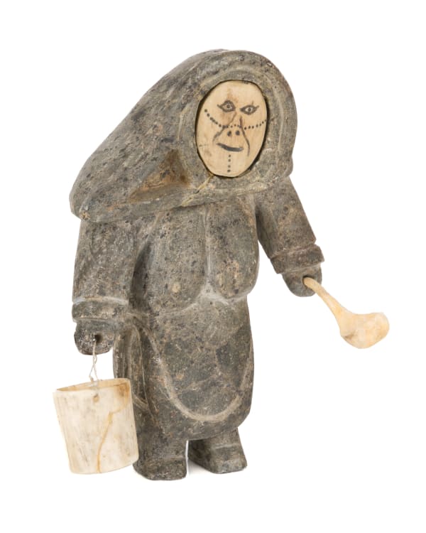 9 UNIDENTIFIED ARTIST, INUKJUAK (PORT HARRISON) Woman with Tattoos, with Water Pail and Scoop, early 1950s stone, bone, antler, sinew, and graphite, 6 x 4.5 x 2.5 in (15.2 x 11.4 x 6.3 cm)