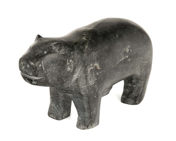 Lot 37 MARK TUNGILIK (1913-1986) NAUJAAT (REPULSE BAY) Bear, late 1970s stone, 5.5 x 9.75 x 3.75 in (14 x 24.8 x 9.5 cm) ESTIMATE: $2,500 — $3,500