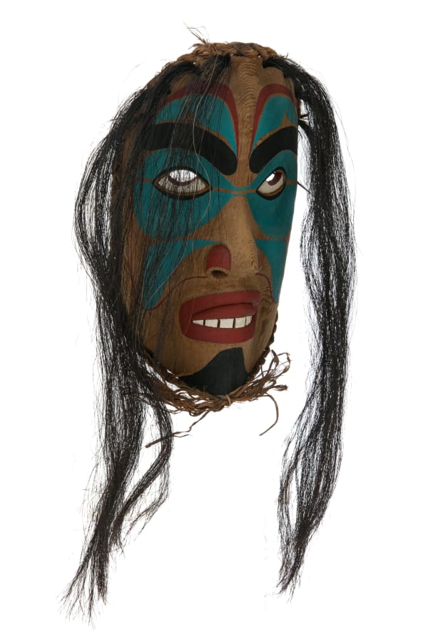 Lot 98 ANDY BRUCE (1970-) KWAKWA̱KA̱ʼWAKW, ALERT BAY, B.C Shaman Mask, c. late 1990s / early 2000s cedar wood, cedar bark, horse hair, and acrylic paint, 12.25 x 7.5 x 5.25 in (31.1 x 19.1 x 13.3 cm) ESTIMATE: $300 — $500 PRICE REALIZED: $312.00