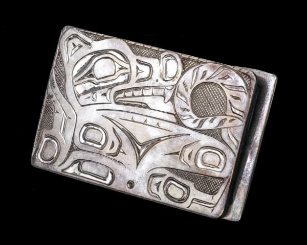 Lot 29 UNIDENTIFIED NORTHWEST COAST ARTIST Spirit Wolf Buckle, c. 1970s / 1980s carved and incised silver, 1.5 x 2.25 in (3.8 x 5.7 cm) ESTIMATE: $100 — $200 PRICE REALIZED: $292.80