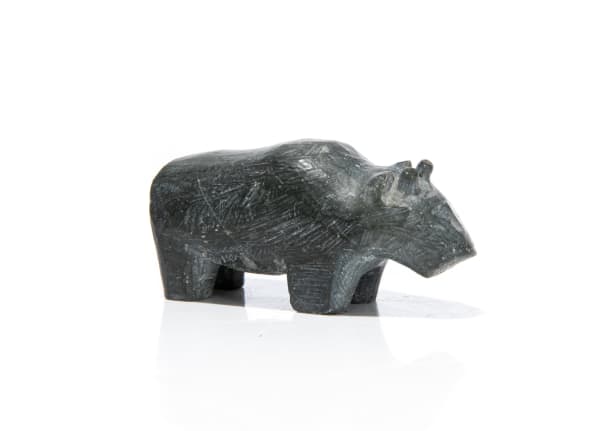 Lot 64 UNIDENTIFIED ARTIST Muskox, c. 1960s stone, 1 x 2.25 x .75 in (2.5 x 5.7 x 1.9 cm) PRICE REALIZED: $73.80