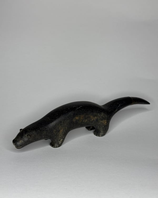 Lot 22 CONLUCY NAYOUMEALOOK (1891-1958) INUKJUAK (PORT HARRISON) Standing Otter, 1960s stone, 1.75 x 7.5 x 1.25 in (4.4 x 19.1 x 3.2 cm) ESTIMATE: $200 — $400