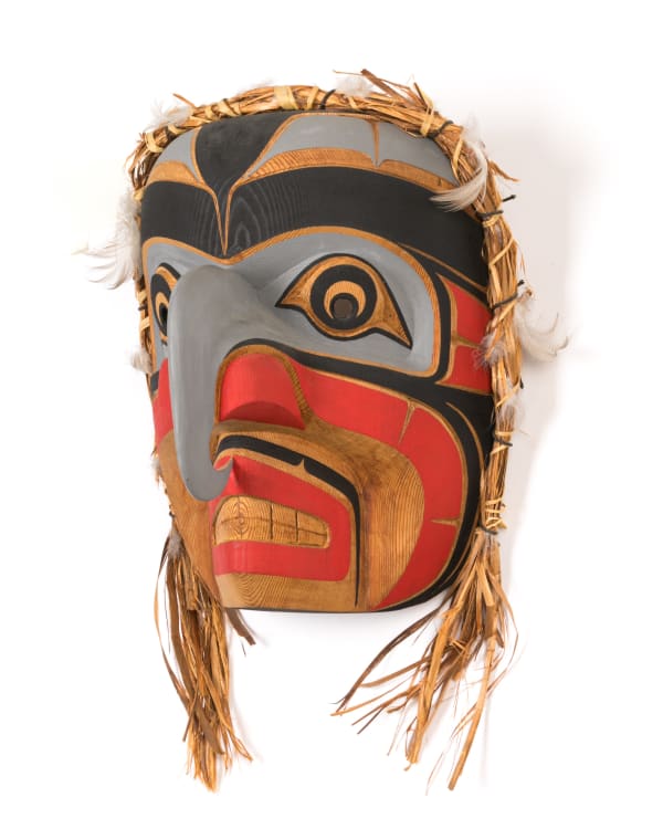 Lot 18 Attributed to NANCY DAWSON (1954-) KWAKWA̱KA̱ʼWAKW Kwagiulth Hawkman, 1988 red cedar, cedar bark, feathers, acrylic paint, and cotton thread, 12 x 8.5 x 7.5 in (30.5 x 21.6 x 19.1 cm) ESTIMATE: $800 — $1,200 PRICE REALIZED: $854.00