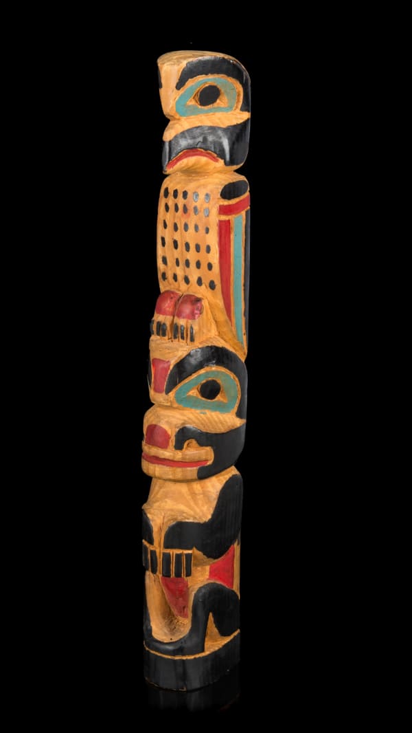 Lot 35 JOHN MICHAEL (1875-1942) TLINGIT, SITKA, ALASKA Model Totem Pole, c. 1930s cedar wood and paint, 12.25 x 1.75 x 2.25 in (31.1 x 4.4 x 5.7 cm) ESTIMATE: $300 — $500