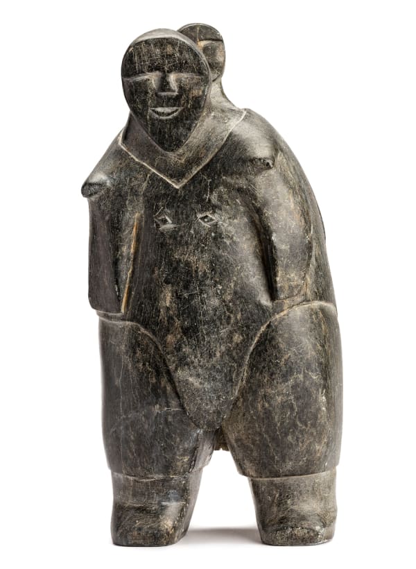 FRANCIS KALURAQ (1931-1990) QAMANI'TUAQ (BAKER LAKE) Standing Mother and Child, c. 1963-64 stone, 13.5 x 6.5 x 4.25 in (34.3 x 16.5 x 10.8 cm)