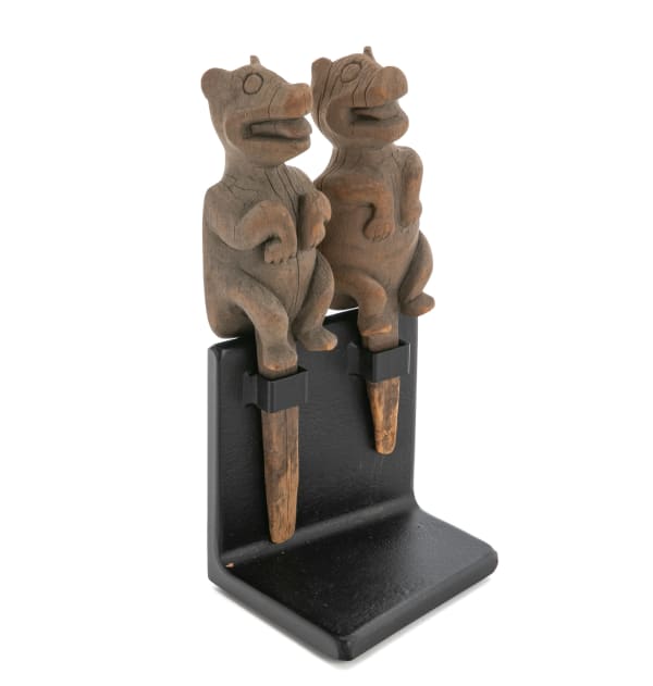 Lot 12 UNIDENTIFIED TLINGIT ARTIST Pair of Objects with Bear Finials, c. 1880s or 1890s each wood, 8 x 2 x 1.5 in (20.3 x 5.1 x 3.8 cm) and smaller ESTIMATE: $800 — $1,200 PRICE REALIZED: $854.00