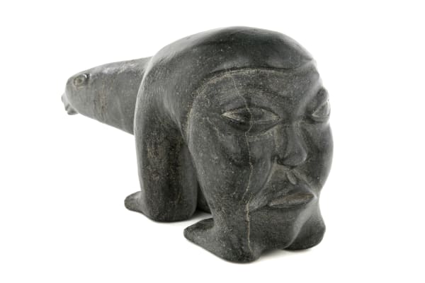 Lot 16 HENRY NAPARTUK (1932-1985) KUUJJUARAPIK (GREAT WHALE RIVER) Hunter's Thoughts of a Polar Bear, c. 1970 stone and antler, 4 x 7.5 x 2.5 in (10.2 x 19.1 x 6.3 cm) ESTIMATE: $1,000 — $1,500 PRICE REALIZED: $960.00