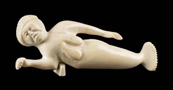Lot 158 UNIDENTIFIED ARTIST, POSSIBLY IGLOOLIK Reclining Sea Goddess, mid 1960s 1.75 x 4.25 x 1 in (4.4 x 10.8 x 2.5 cm) ESTIMATE: $800 — $1,200 Price Realized: $840