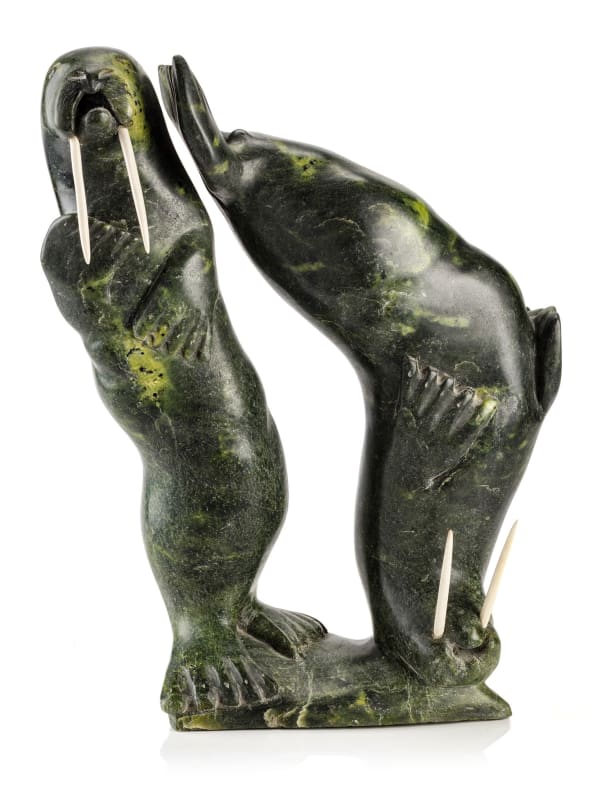 Lot 100 AQJANGAJUK SHAA, R.C.A. (1937-2019) KINNGAIT (CAPE DORSET) Two Walruses, 1976 stone and antler, 17.5 x 13.5 x 6.25 in (44.5 x 34.3 x 15.9 cm) ESTIMATE: $3,500 — $5,000 PRICE REALIZED: $3,660.00