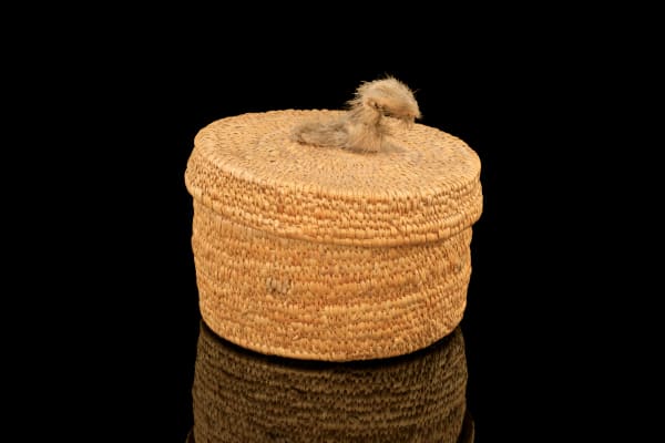 Lot 94 UNIDENTIFIED ARTIST, NUNAVIK (ARCTIC QUEBEC) Wove Basket with Animal Knob, c. 1970s wove lime grass and sealskin, 4.25 x 4.75 x 4.75 in (10.8 x 12.1 x 12.1 cm) ESTIMATE: $200 — $300 PRICE REALIZED: $144.00