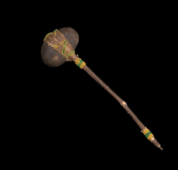 Lot 66 UNIDENTIFIED PLAINS ARTIST, PROBABLY SIOUX Stone Head Club, early 20th century hard stone, wood, hide, glass beads, string, and sinew, 14.75 x 4 x 2.75 in (37.5 x 10.2 x 7 cm) ESTIMATE: $100 — $200 PRICE REALIZED: $109.80