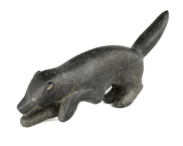 Lot 42 WEETALTUK, KUUJJUARAPIK (GREAT WHALE RIVER) or INUKJUAK (PORT HARRISON) Dog, Low and Advancing, 1959 stone, 4 x 8 x 1.75 in (10.2 x 20.3 x 4.4 cm) ESTIMATE: $300 — $500 PRICE REALIZED: $414.80