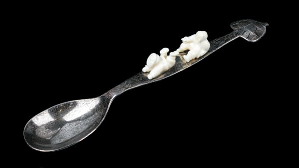 Lot 4 Possibly: ELSIE KLENGENBERG (1946-) ULUKHAKTOK (HOLMAN) Pewter Spoon with Igloo Finial and Two Men, 1999 pewter and antler, 1.25 x 8 x 1.75 in (3.2 x 20.3 x 4.4 cm) ESTIMATE: $100 — $200 PRICE REALIZED: $134.20