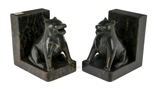 Lot 140 SIMON KASUDLUAK (1925-D) INUKJUAK (PORT HARRISON) Pair of Bookends with Content, Panting Dogs, 1960 stone, 5.25 x 5 x 3.75 in (13.3 x 12.7 x 9.5 cm) ESTIMATE: $1,200 — $1,800