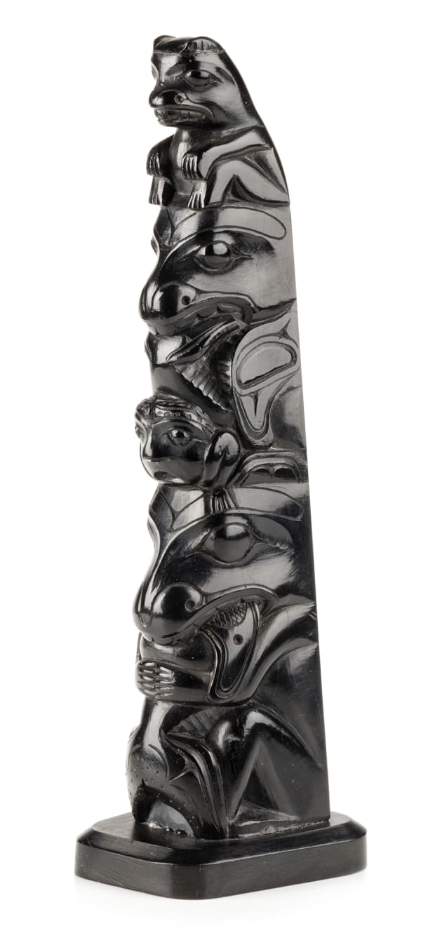 Lot 18 LOUIS COLLINSON (1881-1970) SKIDEGATE, HAIDA GWAII Model Totem Pole, c. 1920s argillite, 8.25 x 2.25 x 2.5 in (21 x 5.7 x 6.3 cm) ESTIMATE: $1,500 — $2,500 PRICE REALIZED: $1,708.00