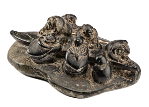 Lot 134 ENNUTSIAK (1893-1967) IQALUIT (FROBISHER BAY) Women Making a Kayak, c. 1958-60 stone and ivory, 3.5 x 10.25 x 7.5 in (8.9 x 26 x 19.1 cm) ESTIMATE: $7,000 — $10,000 PRICE REALIZED: $8,400.00