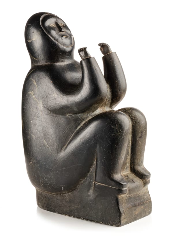Lot 19 PETER SEVOGA (1940-2007), QAMANI’TUAQ (BAKER LAKE) Seated Man with Raised Hands, 1968 stone, 10 x 6.25 x 4 in (25.4 x 15.9 x 10.2 cm) ESTIMATE: $3,000 — $,5000 PRICE REALIZED: $2,880.00