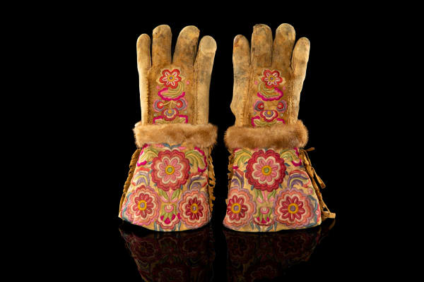 LOT 80 UNIDENTIFIED ARTIST, INNU (MONTAGNAIS) Gauntlet Gloves, late 19th century hide, silk embroidery floss, fur, and cotton thread, each glove, approx.: 12.25 x 7 x 2.5 in (31.1 x 17.8 x 6.3 cm) ESTIMATE: $700 — $1,000
