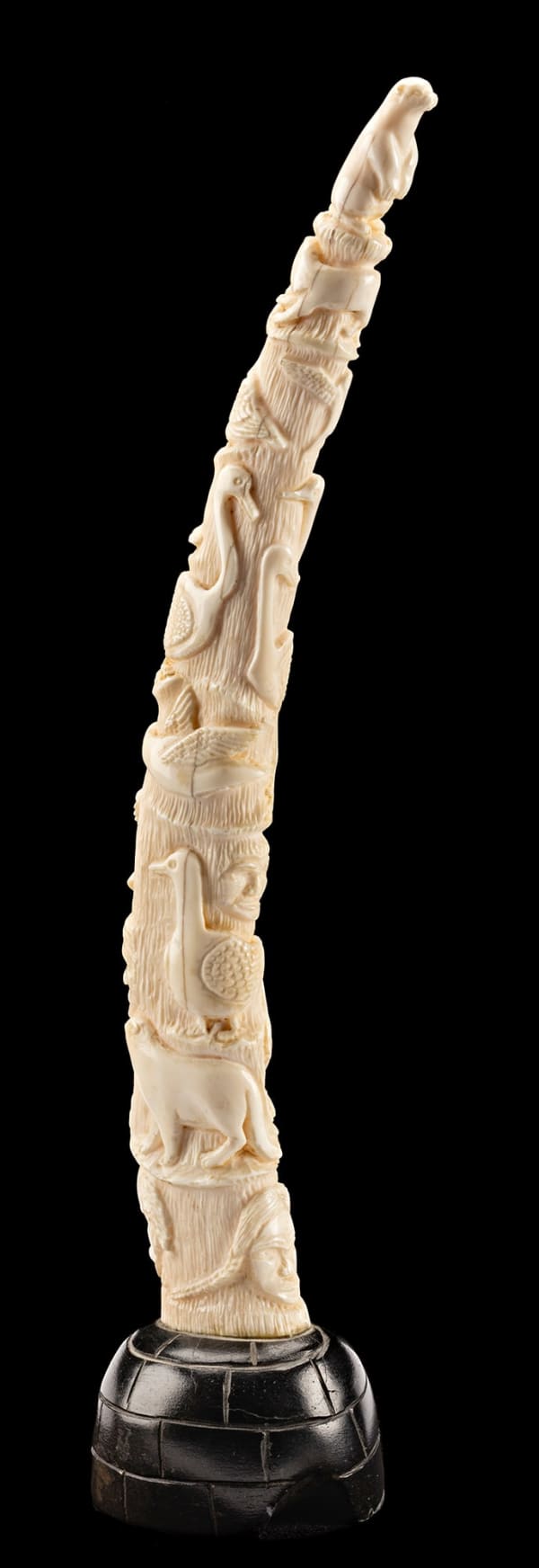 Lot 104 PIERRE KARLIK (1931-2013) KANGIQLINIQ (RANKIN INLET) Carved Tusk on Igloo Base, early 1970s stone and ivory, 13.75 x 3 x 2.75 in (34.9 x 7.6 x 7 cm) ESTIMATE: $2,000 — $3,000 PRICE REALIZED: $1,920.00