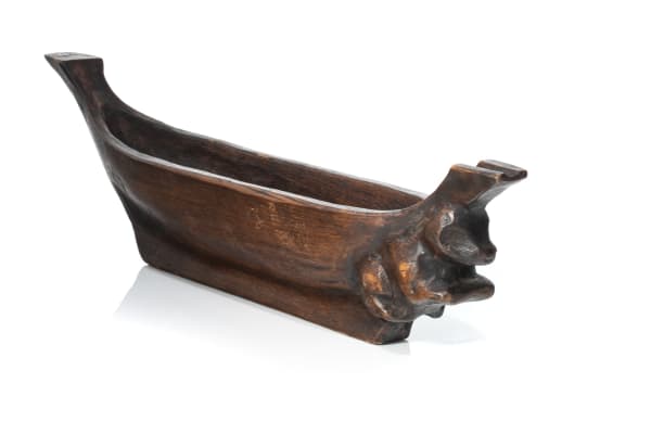 Lot 39 UNIDENTIFIED ARTIST, POSSIBLY TLINGIT OR KWAKWA̱KA̱ʼWAKW Model Canoe with Beaver Holding Chewstick Prow Figure carved and stained cedar wood, 4.75 x 18.75 x 3.25 in (12.1 x 47.6 x 8.3 cm) ESTIMATE: $400 — $600 PRICE REALIZED: $312.00
