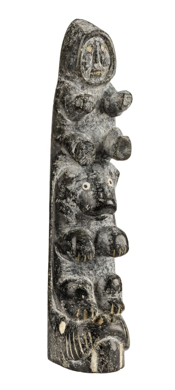 Lot 2 ISA OOMAYOUALOOK (1915-1976), m., INUKJUAK (PORT HARRISON) Totemic Composition with Walrus, Bear and Man, c. 1951 stone, inlay, and soap inlay, 4.75 x 1 x 1 in (12.1 x 2.5 x 2.5 cm) ESTIMATE: $1,000 — $1,500 Price Realized: $2,640