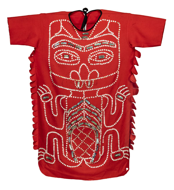 Lot 76 UNIDENTIFIED ARTIST, KAIGANI HAIDA Clan Tunic, c. 1890 tailored red trade cloth ground, decorated with abalone plaques and mother of pearl buttons, arranged in a beaver motif, with a scalloped shaped fringe along the body block; fabric, abalone, mother of pearl buttons, and thread, 45.75 x 41 in (116.2 x 104.1 cm) ESTIMATE: $6,000 — $9,000 Price ReaLized: $7,200