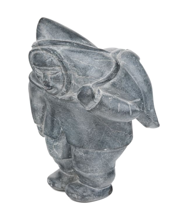 Lot 16 ELIZABETH SIRPALU NAPATU (1916-D) PUVIRNITUQ (POVUNGNITUK) Laden Hunter, Stopping to Rest, 1959 stone, 7.75 x 6 x 5 in (19.7 x 15.2 x 12.7 cm) ESTIMATE: $500 — $800 PRICE REALIZED: $366.00