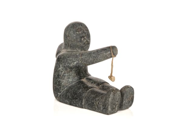 Lot 34 MARY YUUSIPIK SINGAQTI (1936-2017) QAMANI’TUAQ (BAKER LAKE) Seated Child Playing a Game, c. early 1980s stone, sinew, and antler, 4.25 x 3 x 4.75 in (10.8 x 7.6 x 12.1 cm) ESTIMATE: $300 — $500 PRICE REALIZED: $183.00