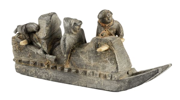 Lot 93 JOE TALIRUNILI (1893-1976) PUVIRNITUQ (POVUNGNITUK) Family on a Qamutiq (Sled), c. 1967-8 stone, wood, ivory, and string, 3.5 x 8.5 x 2.75 in (8.9 x 21.6 x 7 cm) ESTIMATE: $9,000 — $12,000 Price Realized: $9,600