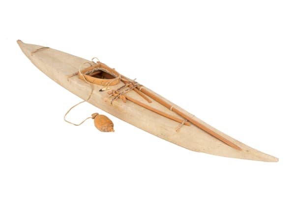 Lot 15 UNIDENTIFIED INUIT ARTIST, EASTERN CANADIAN ARCTIC Model Kayak, c. late 1950s sealskin, wood, sinew, ivory, metal, and thread, 3.25 x 27.5 x 5.25 (8.3 x 69.8 x 13.3 cm) ESTIMATE: $350 — $500 PRICE REALIZED: $414.80