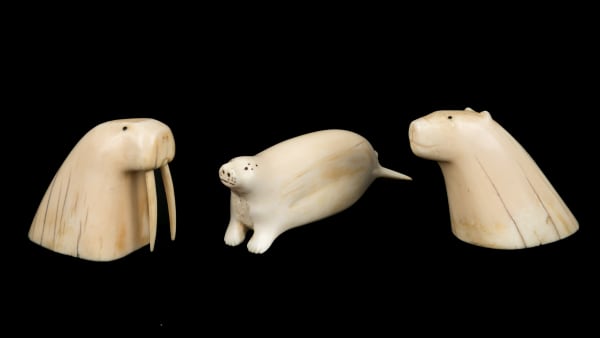 Lot 48 UNIDENTIFIED INUIT ARTISTS, EASTERN CANADIAN ARCTIC Three Arctic Animals, late 1940s / early 1950s each ivory and black inlay, the largest: 1.5 x 4.5 x 1.25 in (3.8 x 11.4 x 3.2 cm) and smaller ESTIMATE: $300 — $500 PRICE REALIZED: $671.00