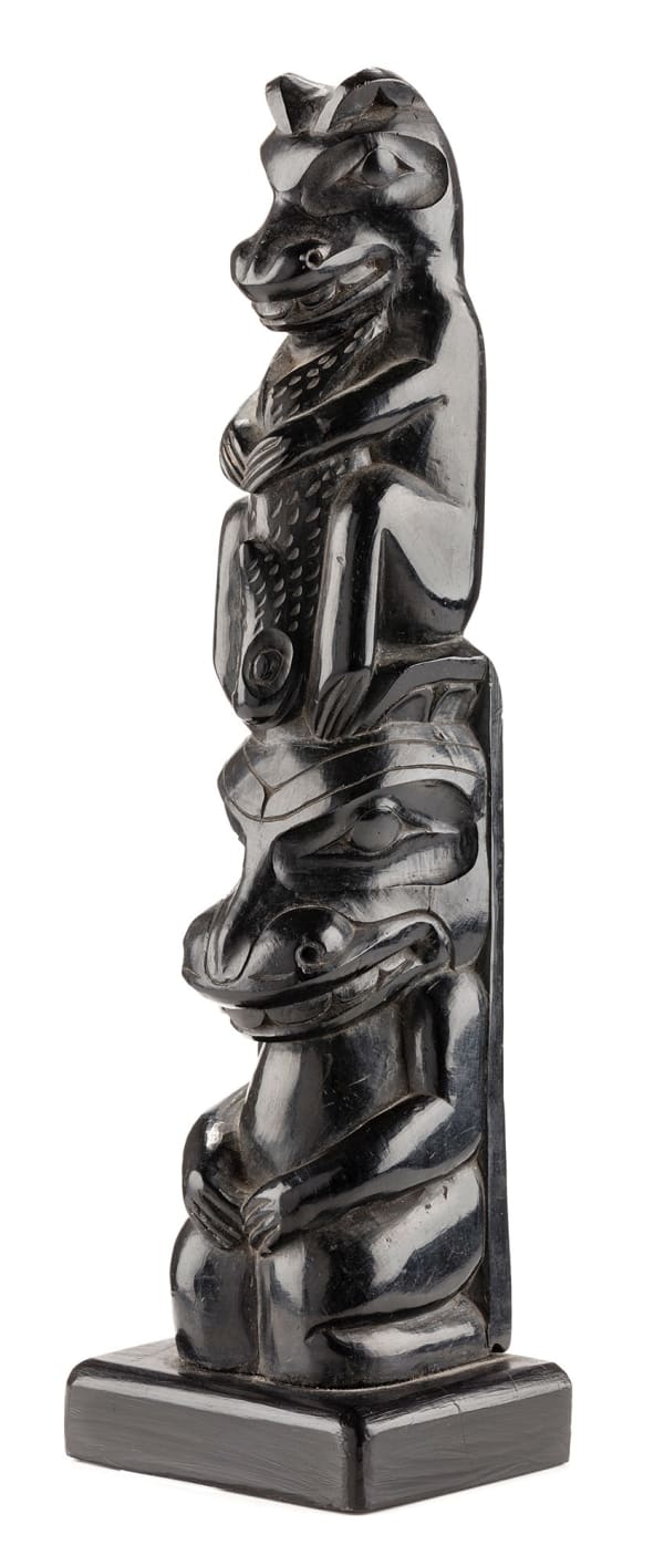 Lot 18 UNIDENTIFIED HAIDA ARTIST Hollow back Model Totem Pole, c. 1900-1910 argillite, 9.75 x 3 x 2.25 in (24.8 x 7.6 x 5.7 cm) ESTIMATE: $2,500 — $3,500 price realized: $2,074.00