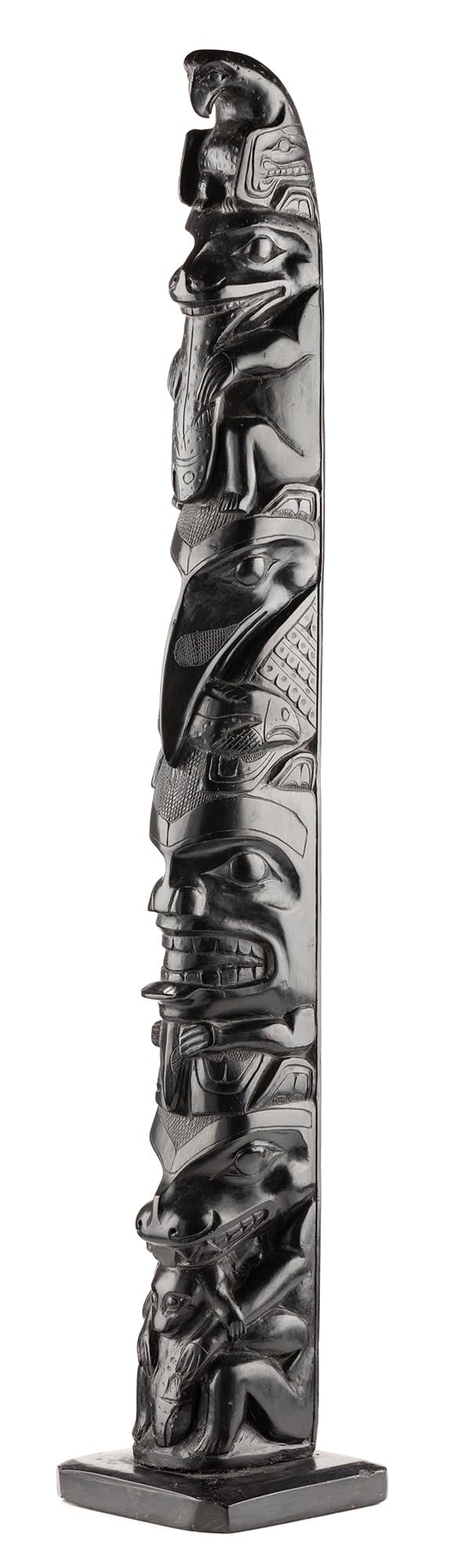 Lot 16 PAUL JONES (c. 1847-1927), SKIDEGATE, HAIDA GWAII Model Totem Pole, c. 1900-1920 argillite, 22 x 4 x 3.75 in (55.9 x 10.2 x 9.5 cm) ESTIMATE: $10,000 — $15,000 Price realized: $14,640.00