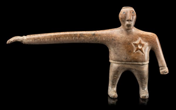 Lot 54 DAVID RUBEN PIQTOUKUN (1950-) PAULATUK / ONTARIO Long Arm of the Law, 2004 stone, 7.5 x 13.25 x 2.25 in (19.1 x 33.7 x 5.7 cm) ESTIMATE: $2,500 — $3,500 price realized: $5,612.00