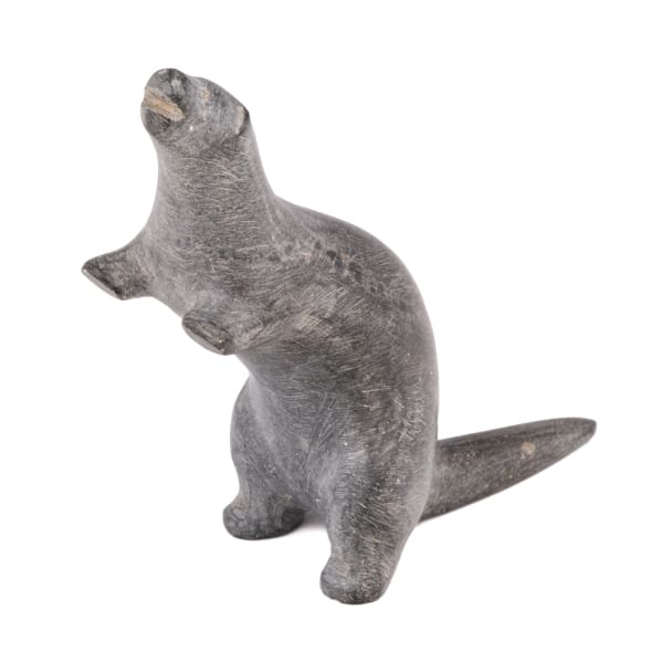 Lot 8 UNIDENTIFIED ARTIST, Probably PUVIRNITUQ (POVUNGNITUK) Otter Standing Guard, early 1950s stone, 3 x 1 x 3 in (7.6 x 2.5 x 7.6 cm) ESTIMATE: $100 — $150 PRICE REALIZED: $793.00