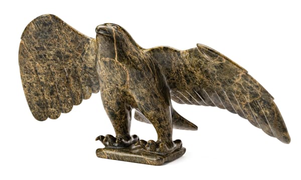 Lot 124 OVILOO TUNNILLIE, R.C.A. (1949-2014) KINNGAIT (CAPE DORSET) Falcon, 1987 stone, 11.75 x 25.25 x 10.75 in (29.8 x 64.1 x 27.3 cm) ESTIMATE: $6,000 — $9,000 PRICE REALIZED: $10,200.00