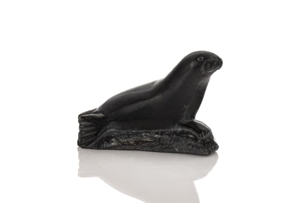 Lot 98 LUCASSIE ECHALOOK (1942-) INUKJUAK (PORT HARRISON) Lounging Seal, mid-late 1970s stone, 3.75 x 5.5 x 2.75 in (9.5 x 14 x 7 cm) ESTIMATE: $100 — $200 PRICE REALIZED: $144.00