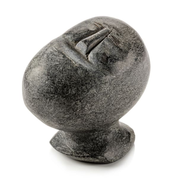 Lot 10 JOHN TIKTAK, R.C.A. (1916-1981) KANGIQLINIQ (RANKIN INLET) Head, c. 1967 stone, 4.5 x 4.75 x 3 in (11.4 x 12.1 x 7.6 cm) ESTIMATE: $5,000 — $8,000 Price realized: $6,100.00